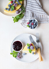 Vanilla no crust cheesecake or cottage cheese casserole decorated with mint and berries. Ricotta casserole. Healthy breakfast or dessert. Top view.