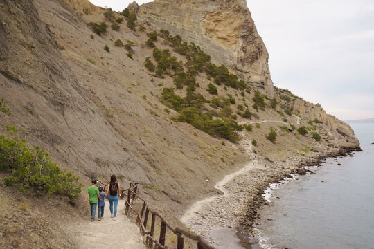 People walk along the Galitsin trail in a Novy Svet in the Crimea
