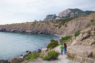 People walk along the Galitsin trail in a Novy Svet in the Crimea
