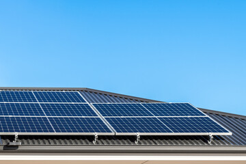Obraz premium Brand new solar panels on a house roof in Australia on a day against clear blue sky