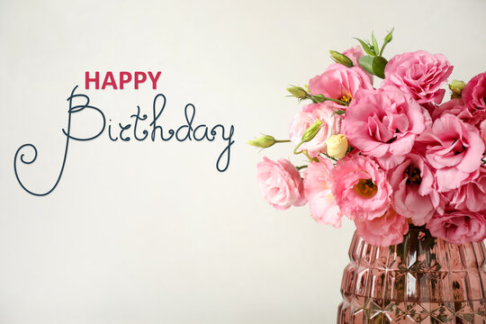 Happy Birthday! Beautiful pink flowers in vase on light background