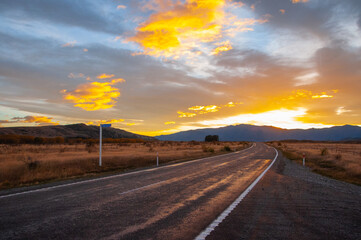 A highway overlooking a sunset 