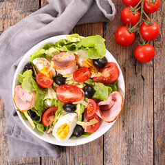 bowl of vegetable salad with egg aand ham