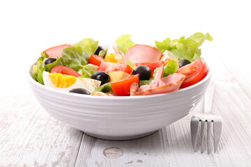 bowl of vegetable salad with egg aand ham