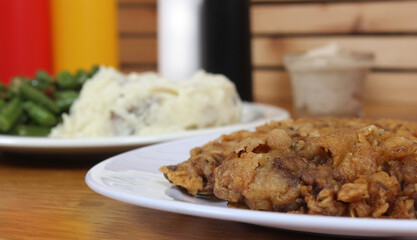 Chicken Fried Steak and Gravy With Mashed Potatoes in Rural Cafe Restaurant