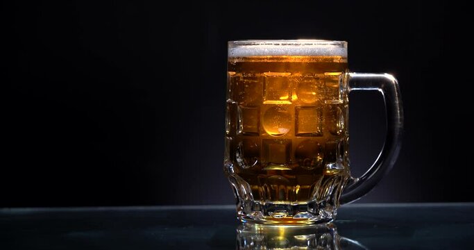 Panorama of light beer on the dark background
