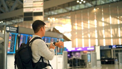 Man traveler waiting in terminal airport 