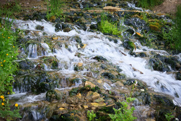 Slovenian Keys waterfall, illuminated source, living water out of the ground in the Izborsk, near Pskov. Travel of Russia.  