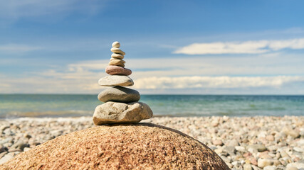 Zen Buddhism Concept with Stack of Stones on the Beach