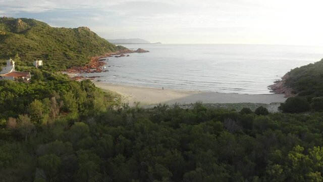  Single person walking along emty beach in Sardinia Pt.2