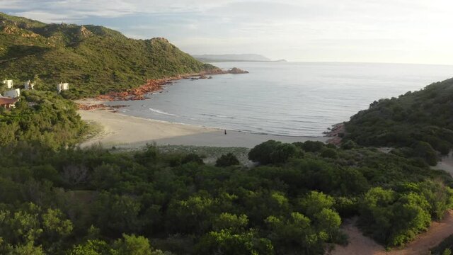 Single person walking along emty beach in Sardinia Pt.1