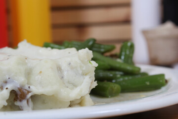 Mashed Potatoes and Green Beans in Rural Cafe Restaurant