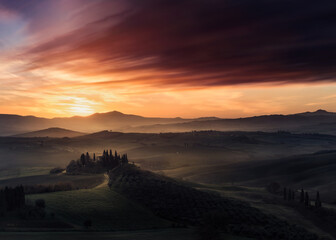 Tuscany in a dark dawn