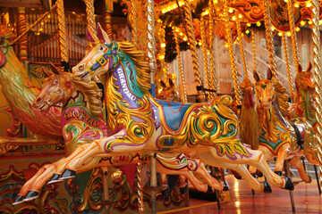 Fototapeta na wymiar Wooden Carousel Horses on a Fun Fair Amusement Ride.