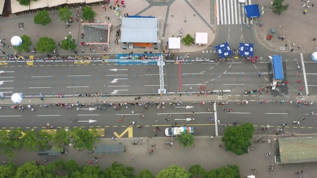 Overhead Aerial Shot Of Participants Arriving At The Finish Line Of A Marathon.