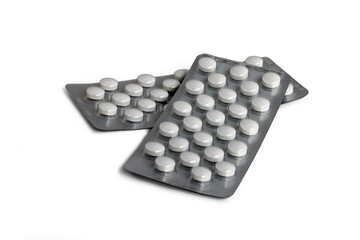 Two blister packs of round pills isolated