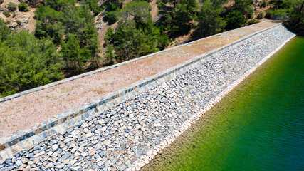 Aerial view of coastline of Cyprus beach.The steep stone cliffs and deep blue sea waves crushing in coves. beautiful turquoise waters of mediterranean