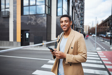 Portrait of kind man enjoying his urban life