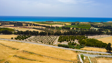 Fototapeta premium panoramic view of Cyprus road along coastline and small villages, aerial photography of popular tourist destination. clear sky