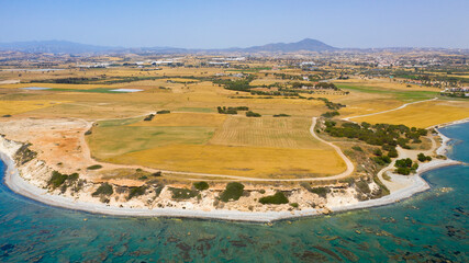 Fototapeta na wymiar Akamas Peninsula from Paphos, Cyprus, aerial view of sea coastline, wild beach, yellow landscape, blue lagoon, popular tourist attraction