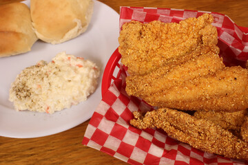 Fried Catfish With Coleslaw and French Fries in Rural Cafe