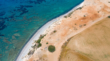 Aerial view of coastline of Cyprus beach.The steep stone cliffs and deep blue sea waves crushing in coves. beautiful turquoise waters of mediterranean