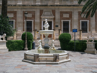 Fountain located in front of the General Archive of the Indies in Seville, Spain. American...