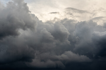 Naklejka na ściany i meble Dramatic sky with dark clouds. Nature background.