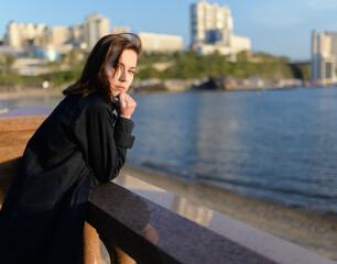 Woman in enjoys the sea shore.