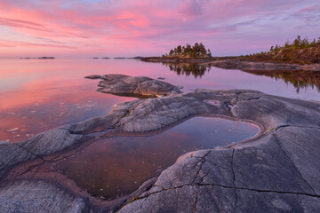 Stone shore of Lake Ladoga on a summer evening