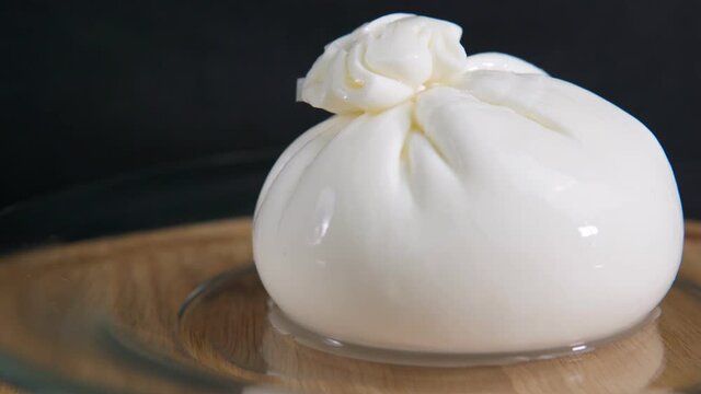 White burrata cheese ball made from mozzarella and close up