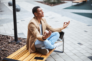 Fototapeta na wymiar Relaxed male person enjoying process of meditation