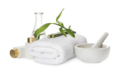 Composition with fresh bamboo, cosmetic products and towel on white background