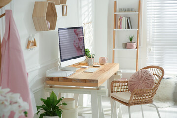 Stylish home office interior with comfortable workplace
