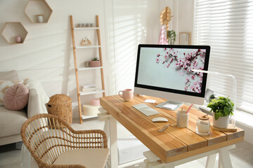 Fototapeta na wymiar Stylish home office interior with comfortable workplace