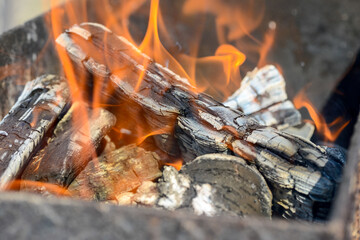 burning fire with coals in the grill close-up
