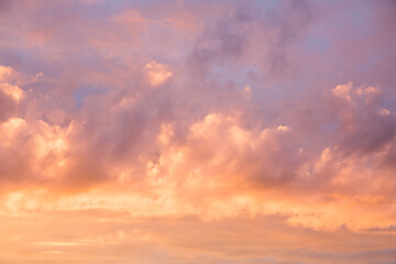 Fototapeta na wymiar Photo of clouds and sky at sunset. Orange and red shades of sunset light.