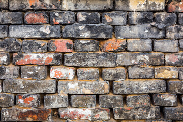Brick wall of old faded bricks as a background. Grunge texture. Loft style.	
