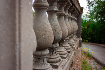 Old balustrade. Concrete balusters. Cracked balustrade.