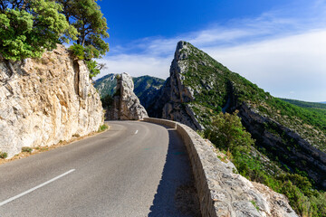 Beautiful  narrow road surrounded by rocks in Verdon Gorge national park in French Alps.