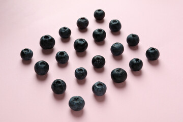 Fresh berry concept with blueberry on pink background