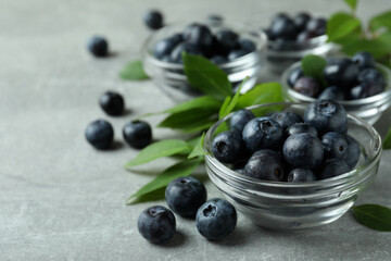 Fresh berry concept with blueberry on gray textured table