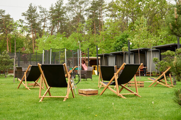 The place for longe, Deck chairs. Kind on the playground jumping on the trampoline in the back yard