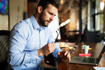 Businessman working on the project. Businessman working in the office on his laptop