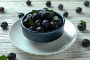 Fresh berry concept with blueberry on white wooden table