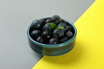 Fresh berry concept with blueberry on two tone background
