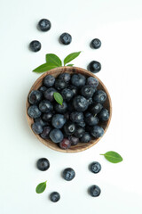 Fresh blueberry with leaves on white background