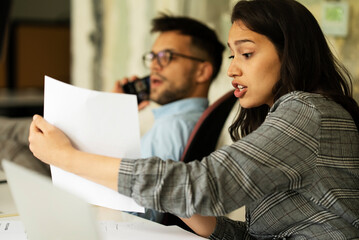 Colleagues in office. Businesswoman and businessman discussing work in office