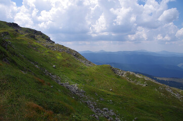 Mountain panoramic landscape with clouds and blue sky