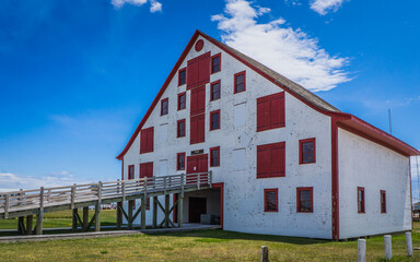 View on the buildings of the Paspebias National historic site in Quebec (Canada), an open-air museum with original cod fishing buildings from the 19th century 